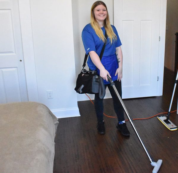 woman vacuuming floor