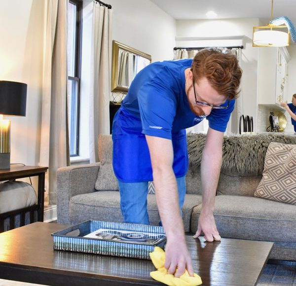 man cleaning a table
